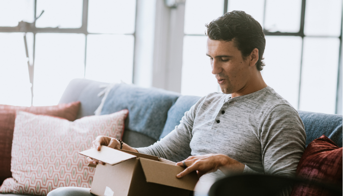 (man getting product to test in mail)